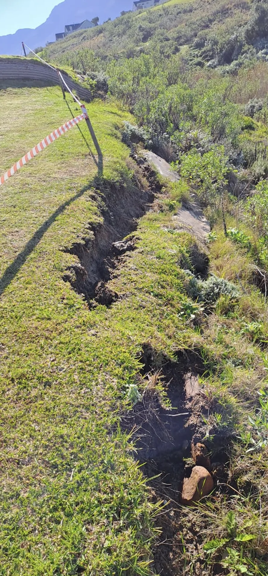 The downpours cut dongas into the earth surrounding a bunker face. The downpours cut dongas into the earth surrounding a bunker face.